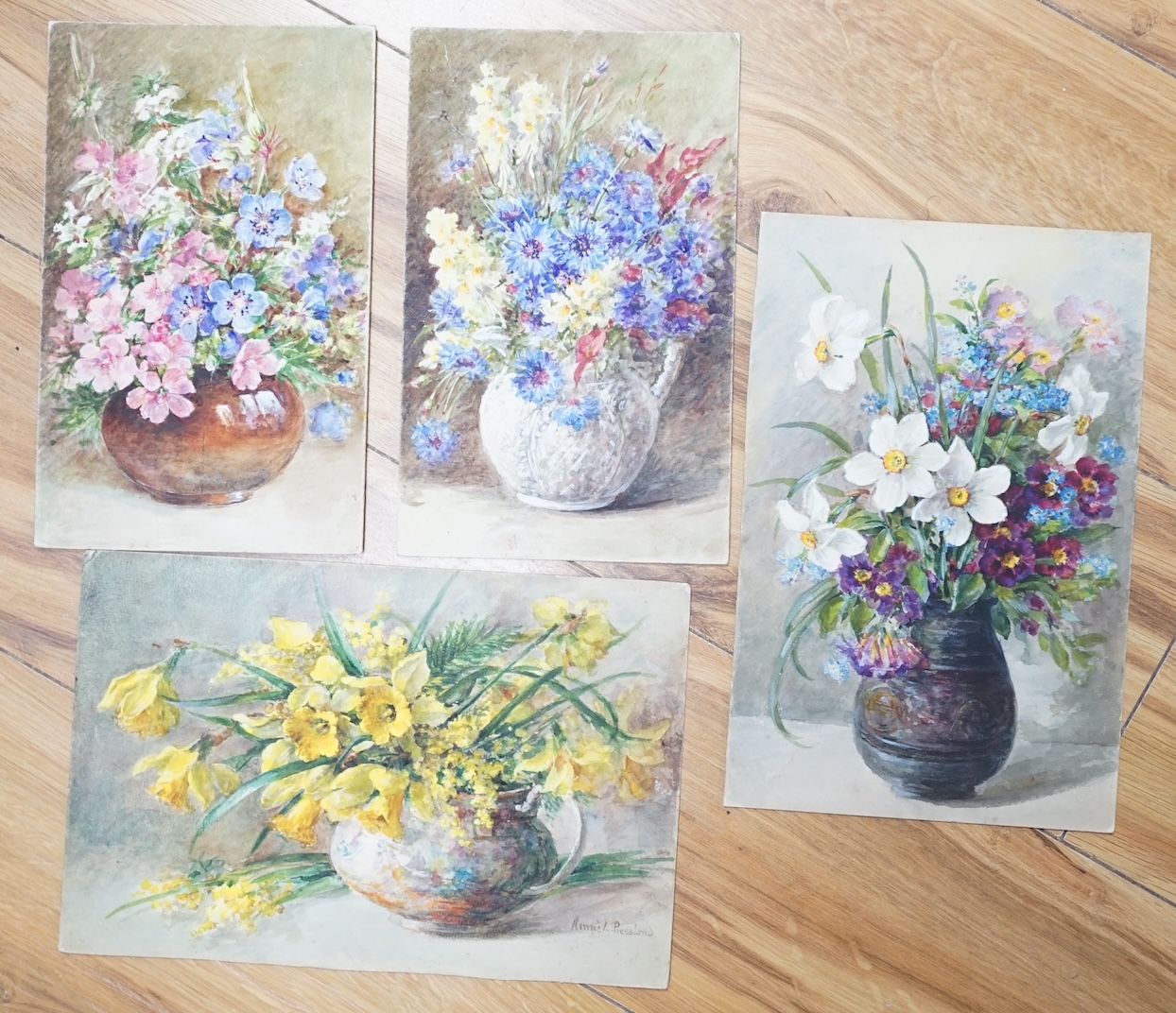 Annie L. Pressland (1862-1933), four watercolours on card, ‘Blue Cranesbill & Musk Mallow’, ‘Daffodils & Mimosa’, Yellow Snapdragons & Cornflowers’ and ‘Narcissi & Auriculas’, one signed, unframed, largest 27 x 17.5cm. C